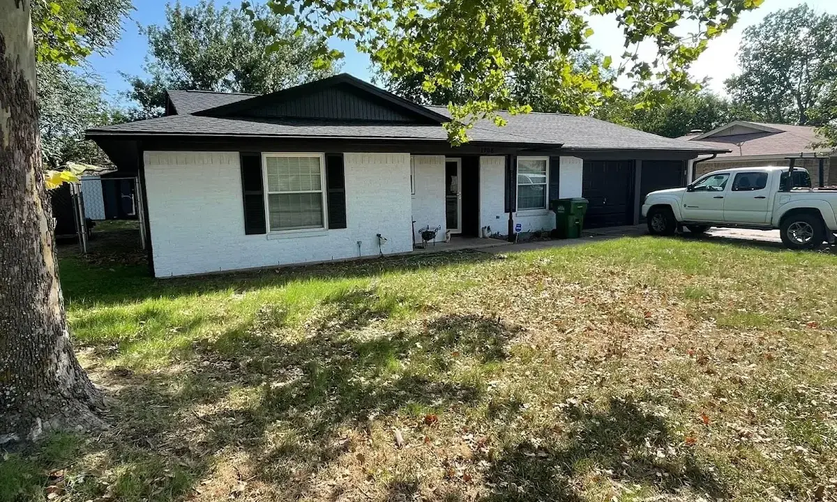 Professional roofing crew working on a residential roof in La Marque